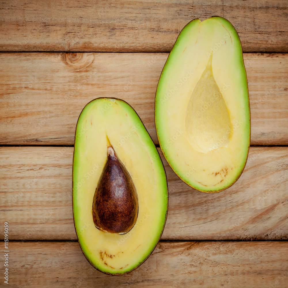 Fresh avocado on wooden background. Organic avocado healthy food