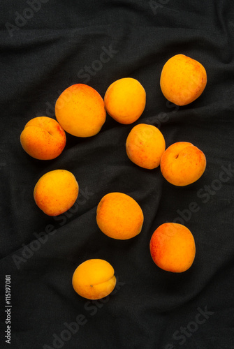 fresh apricots in red plate