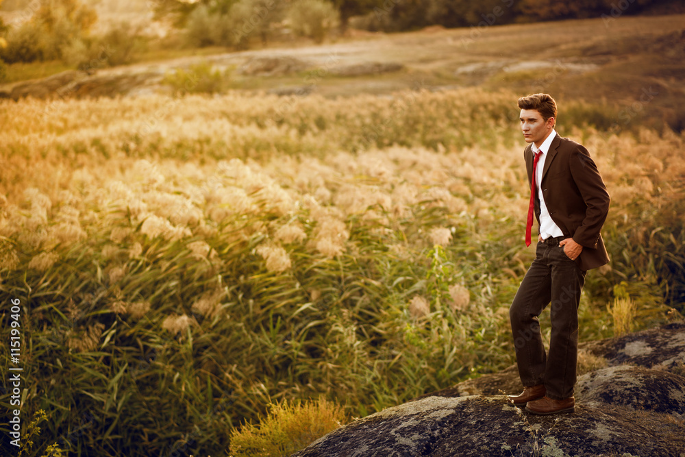 Man in the sunset on the background of reeds Man in the sunset on the background of reeds