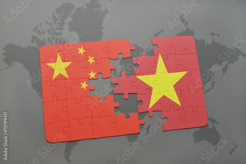 Canvas Print puzzle with the national flag of china and vietnam on a world map background