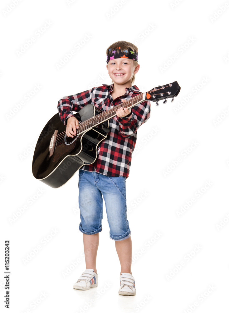 Naklejka premium boy stands and plays the guitar isolated on white background