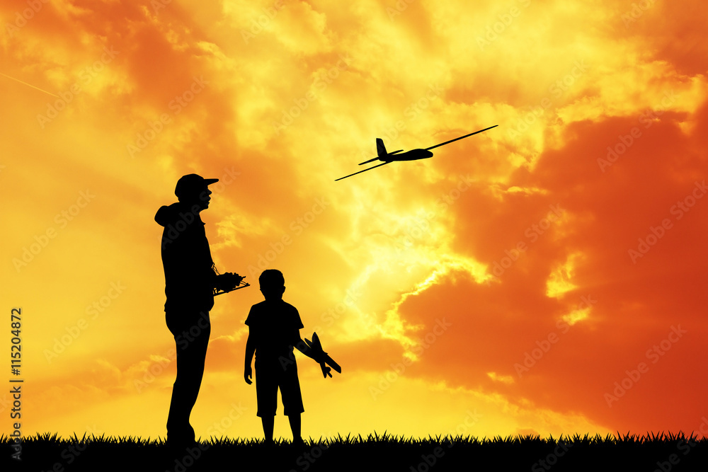 man and child with a airplane model remote control