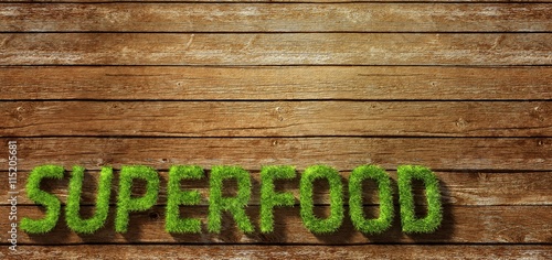 Superfood made of grass on wood background