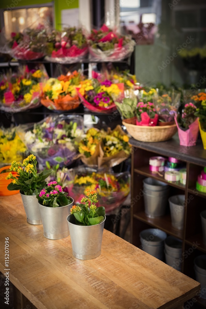 Flower vase arranged on a wooden worktop