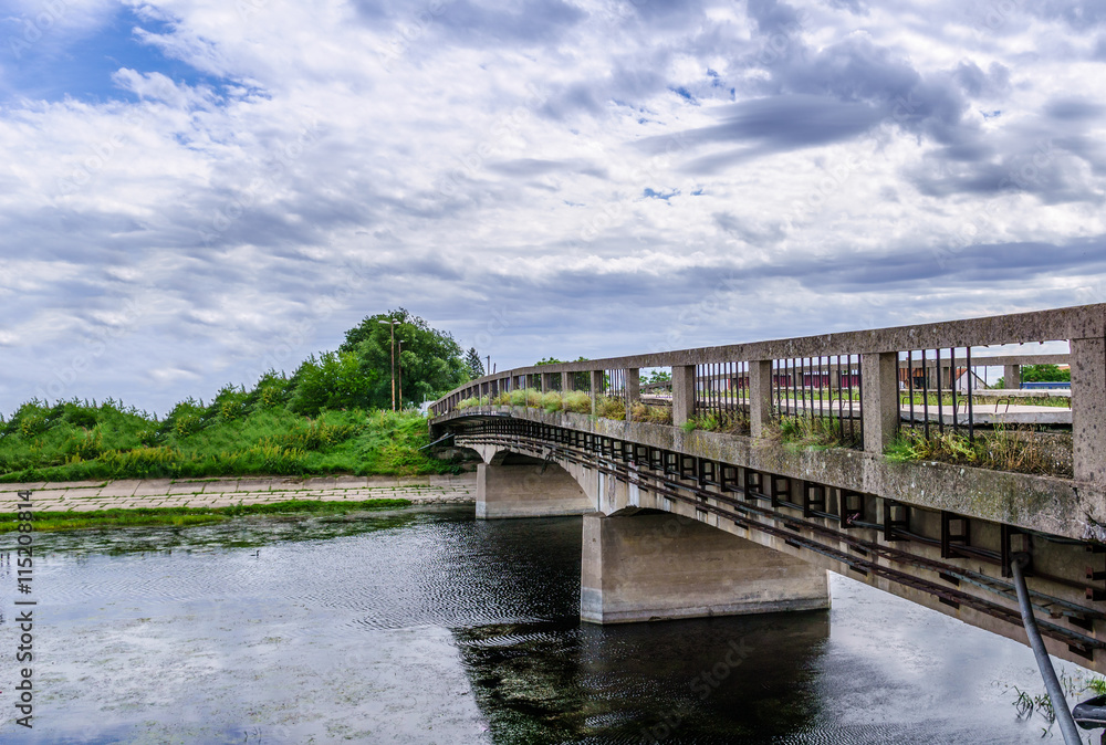 Panorama of old abandoned bridge across river (color version)