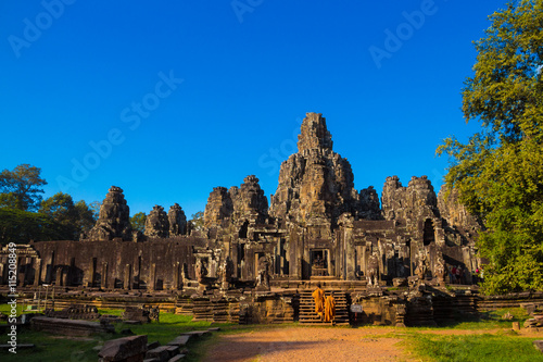 The monks in the ancient stone faces of Bayon temple