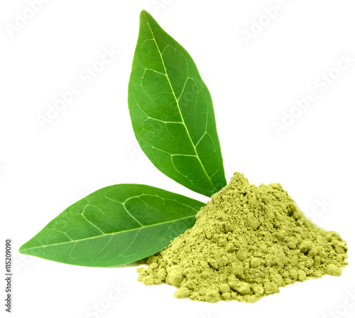 Green  powder matcha tea with green leaves isolated on white
