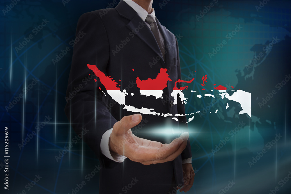 Businessman showing map of Indonesia on globe background