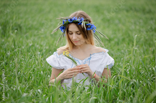 romantic portrait of the beautiful girl with a flower in her hair