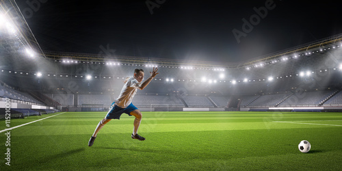 Soccer player hitting ball   . Mixed media © Sergey Nivens