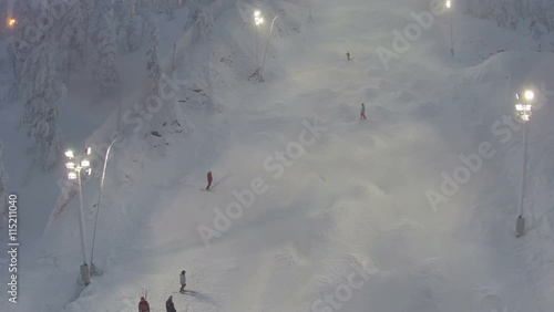 Sportsmen are having a training on the slope for mogul skiing, aerial shot