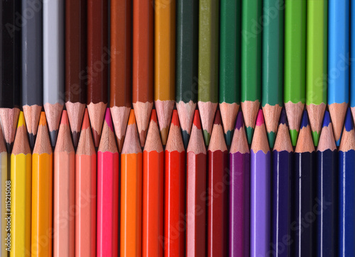 Background of colored pencils with the tips facing aligned