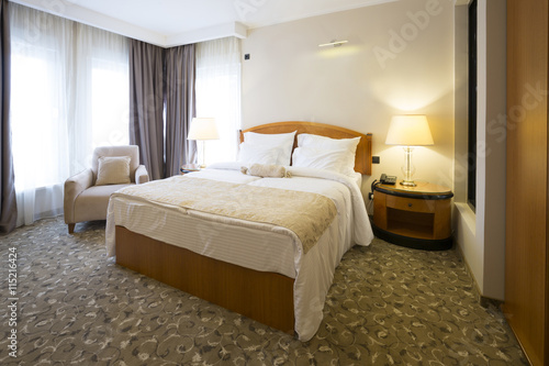 Classic style hotel bedroom interior © rilueda