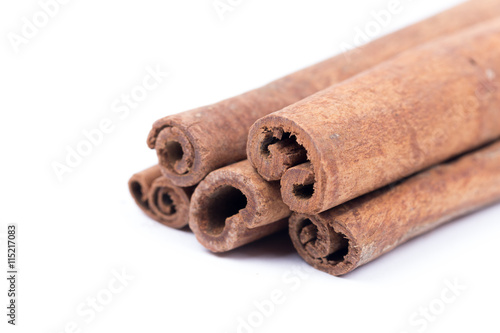 Cinnamon sticks isolated over white background