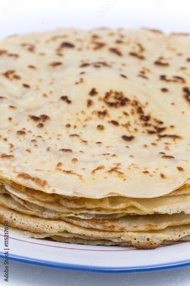 Homemade pancakes on the plate. Isolated on white background. Homemade pancakes on the plate. Isolated on white background.