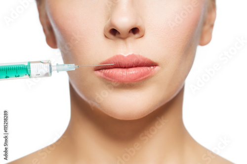 woman face and syringe making injection