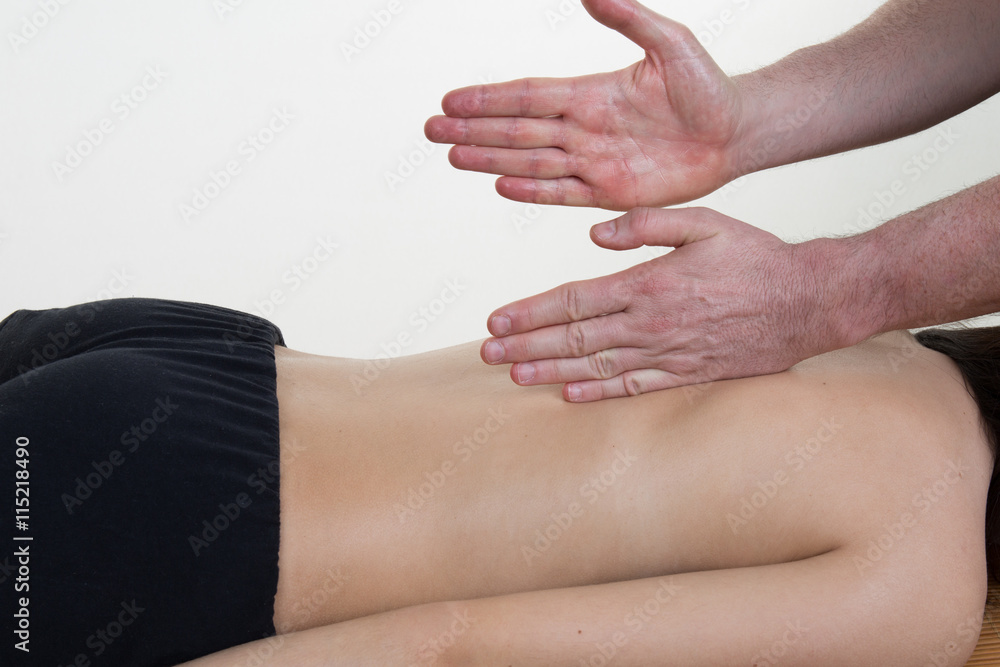 Young woman relaxes as enjoys a luxurious spa treatment from a female Young woman relaxes as enjoys a luxurious spa treatment from a female