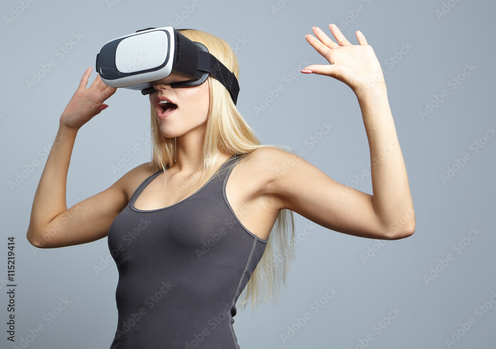 Smile happy woman getting experience using VR-headset glasses of