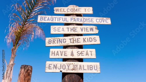 summer day malibu beach famous welcome sign blue sky view 4k time lapse 
