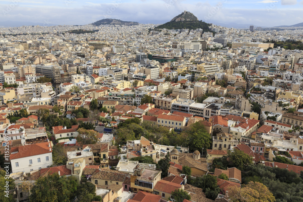 Elevated Athens city view from the Acropolis, towards Lykavittos Hill and Parliament across Plaka and Syntagma, Athens, Greece Elevated Athens city view from the Acropolis, towards Lykavittos Hill and Parliament across Plaka and Syntagma, Athens, Greece