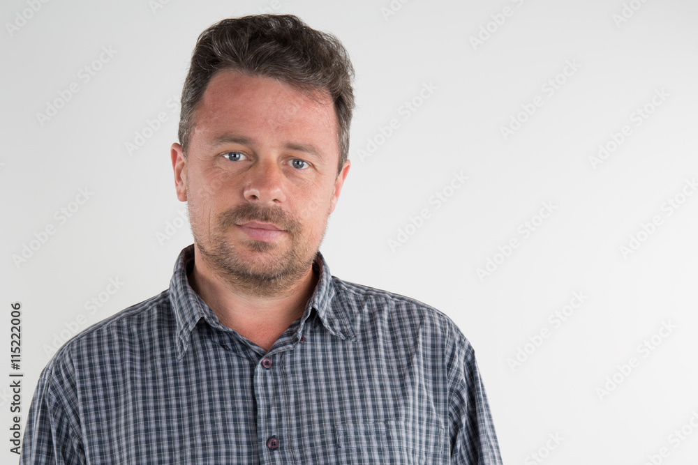 Handsome man in casual wear smiling while standing isolated Handsome man in casual wear smiling while standing isolated
