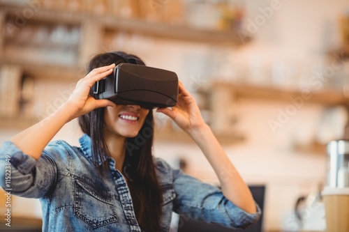 Young woman using the virtual reality headset photo