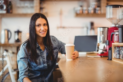 Portrait of woman having coffee
