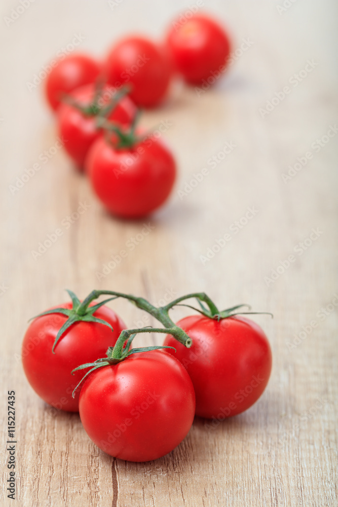 cherry tomatoes on a wooden surface cherry tomatoes on a wooden surface