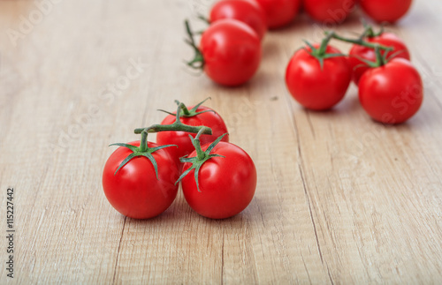 cherry tomatoes on a wooden surface