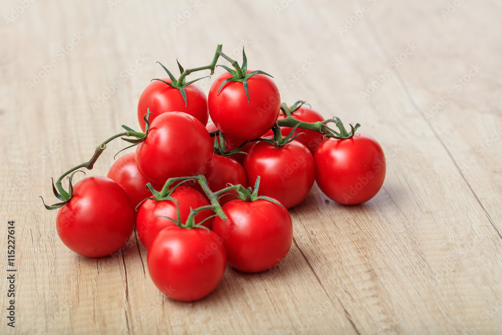 cherry tomatoes on a wooden surface cherry tomatoes on a wooden surface