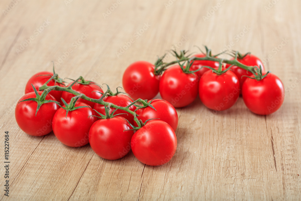 cherry tomatoes on a wooden surface cherry tomatoes on a wooden surface
