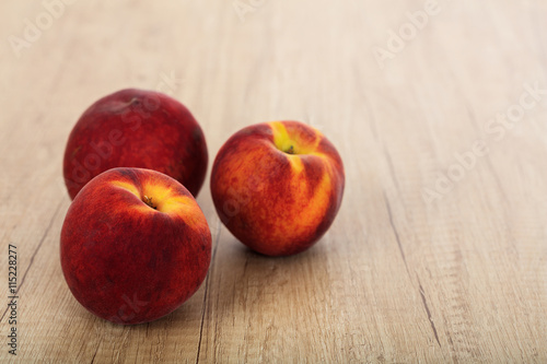 Peaches on a wooden surface