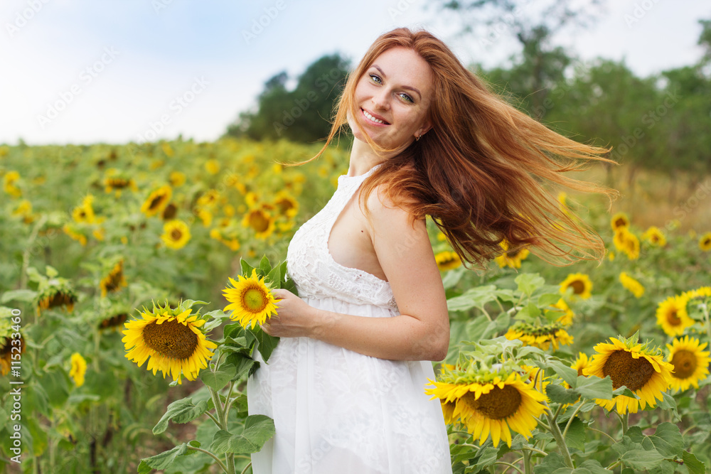 Pregnant woman in the field with sunflowers Pregnant woman in the field with sunflowers