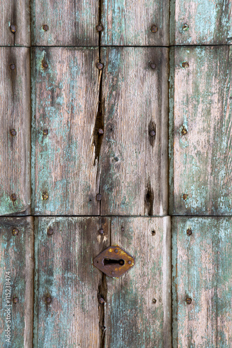   knocker in a  door curch  e pozzolo photo