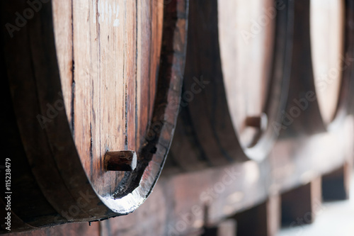 Old wine barrels in the wine cellar, Madeira island, Portugal.  photo