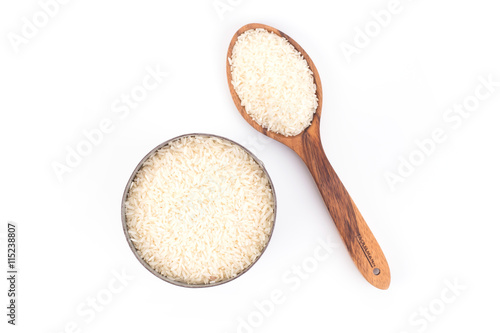 Brown wooden spoon and rice isolate on background white