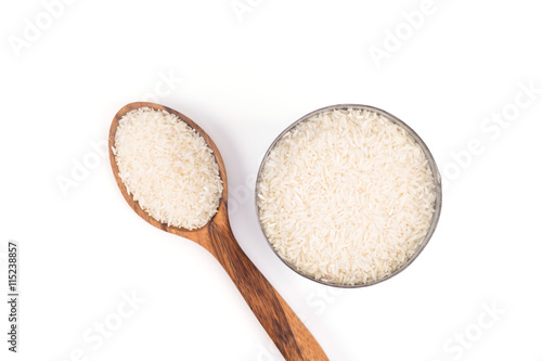 Brown wooden spoon and rice isolate on background white
