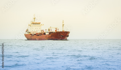 Cargo ship sailing in still water