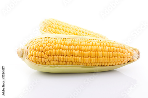 corn cob isolated on white background with. with green leaves