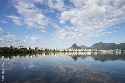 Scenic skyline morning view of Lagoa Rodrigo de Freitas lagoon in Rio de Janeiro, Brazil with Ipanema and Leblon reflecting on the calm horizon 