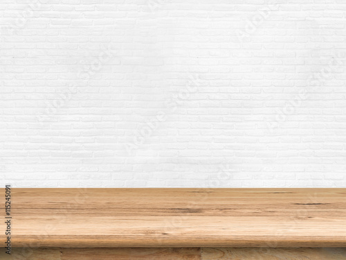 empty wooden shelf on white brick wall background