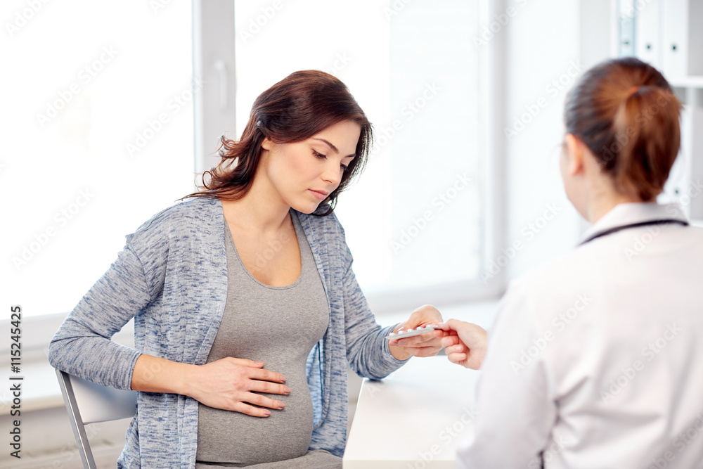 gynecologist doctor and pregnant woman at hospital gynecologist doctor and pregnant woman at hospital