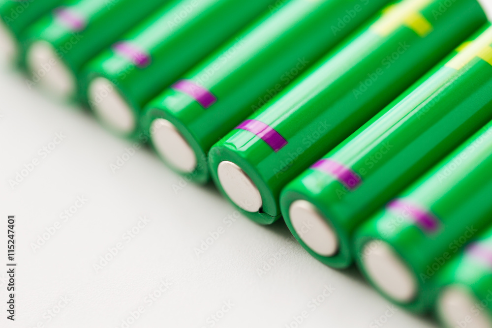 close up of green alkaline batteries close up of green alkaline batteries