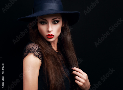 Mysterious makeup woman in fashion hat looking expressive on bla © nastia1983