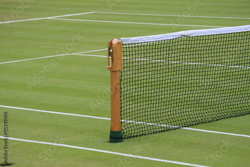 Wooden net post on grass court at Wimbledon © Irmelamela