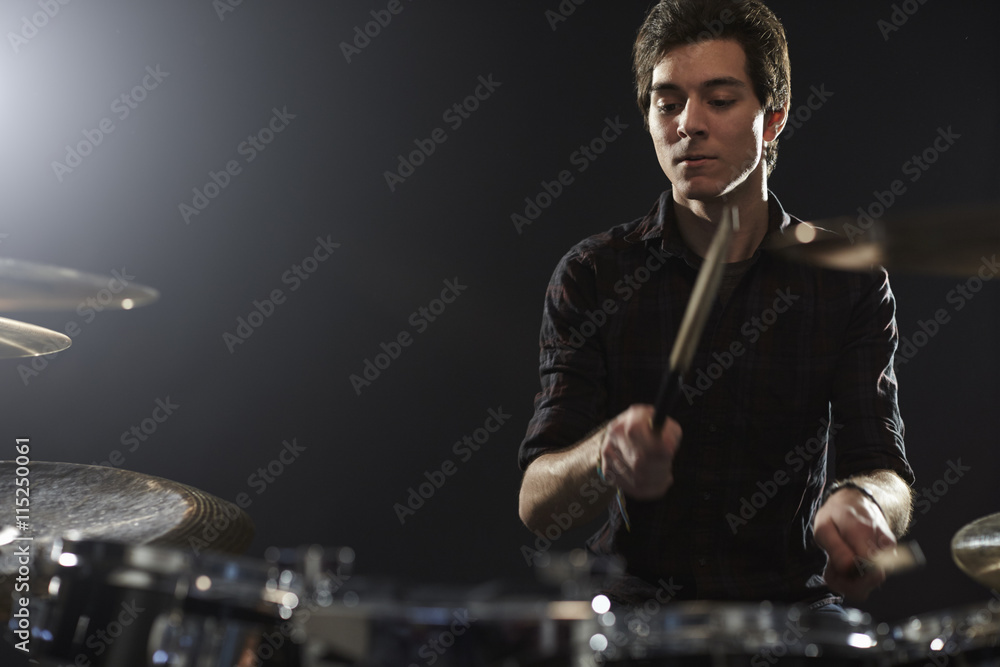 Young Drummer Playing Drum Kit In Studio Young Drummer Playing Drum Kit In Studio