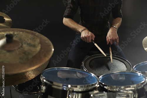Close Up Of Drummer Playing Snare Drum On Kit In Studio
