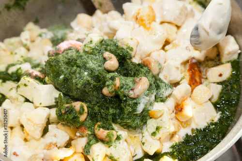 Closeup of Indian spinach dish with cheese photo