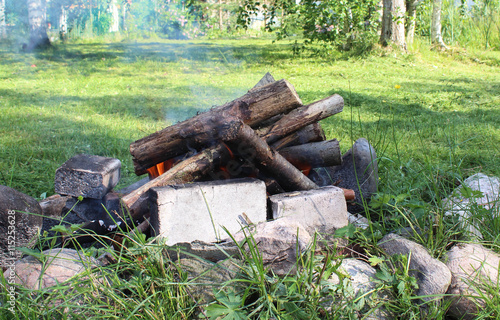 Campfire in the summer day