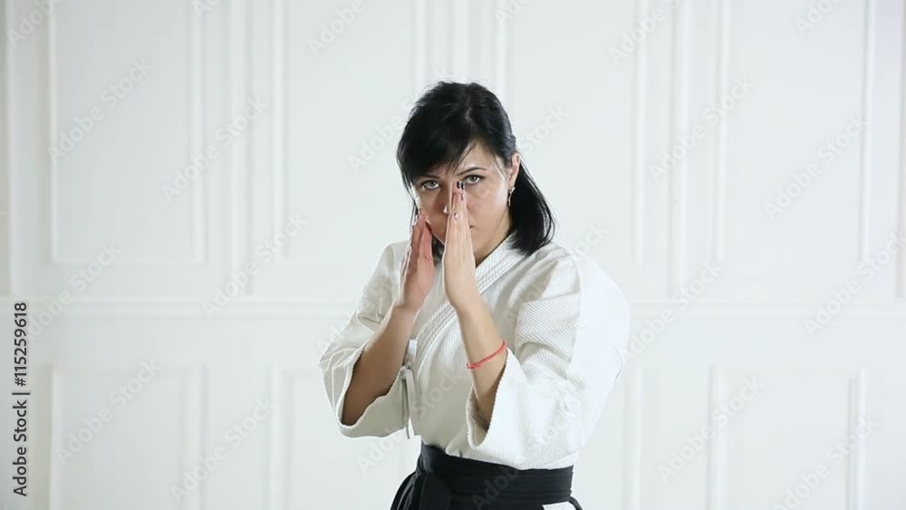 beautiful woman wearing a hakama engaged in Jiu Jitsu beautiful woman wearing a hakama engaged in Jiu Jitsu